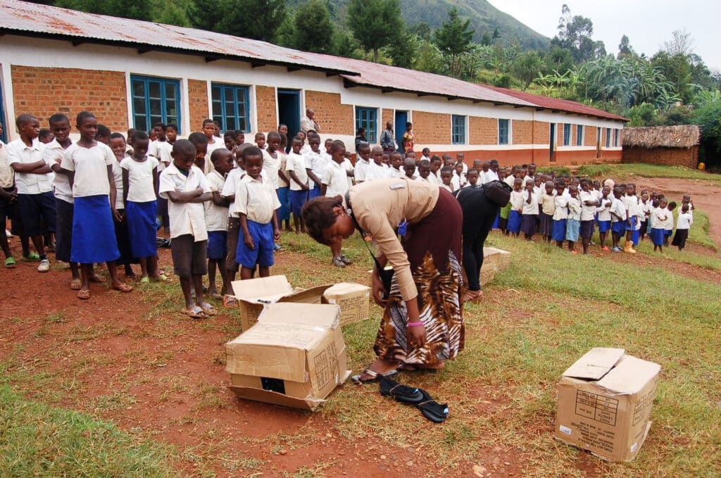 woman unpacking supplies for kids